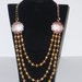 Collana con perle color bronzo
