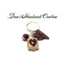 anello multicharm con biscotto e barretta di cioccolato in fimo e perlina marrone