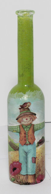 Bottiglietta porta essenze con spaventapasseri  e sfondo verde