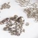 Mix componenti metallici - Catene, perle, distanziali - colore argentato