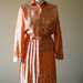 Shiny Orange 1980's vintage secretary polyester dress with White Oriental Flowers, Made in El Salvador, Excellent condition.