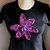 T-Shirt personalizzate/Personalized large size short sleeve black woman's T-shirt with hand-knitted application- bright purple flower.
