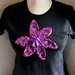 T-Shirt personalizzate/Personalized large size short sleeve black woman's T-shirt with hand-knitted application- bright purple flower.