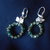 orecchini con fiocchetto e cristalli verdi