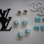 Lotto ciondoli lv orecchini tiffany blue e orecchini chanel