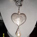 Collana in perle di fiume,pendente con cuore in argento rimovibile, chiusura moschettone in argento e zirconi