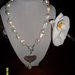 Collana in perle di fiume,pendente con cuore in argento rimovibile, chiusura moschettone in argento e zirconi
