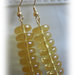 collana color ambra in perle di vetro e catena dorata