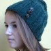 Cappello in lana verde con bottoni