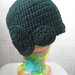 Cappello lana verde uncinetto con decorazioni