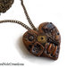 collana in bronzo con cuore steampunk  creato a mano in fimo con ingranaggio orologio