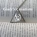 Collana con I Doni della Morte di Harry Potter e La Ghiandaia Imitatrice di Hunger Games 