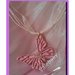 Collana con farfalla rosa glitterata