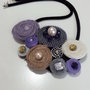 Collana con girelle in materiale vario