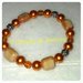 braccialetto elastico con  perle color ambra
