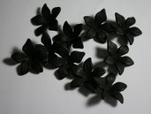 10 coppette nere in resina opaca. 10 coppette black in opaque resin.