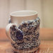 Copri tazza - mug fatto a maglia con fiocco di neve in feltro bianco