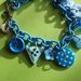 Bracciale charms bottoni azzurri 