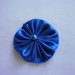 Yo-yo circolare (diametro 6 cm) di stoffa color azzurro lucido