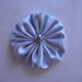 Yo-yo circolare (diametro 6 cm) di stoffa color grigio perla