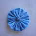 Yo-yo circolare (diametro 6 cm) di stoffa color celeste