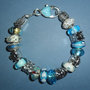 Bracciale con perle in vetro di murano e beads argentati