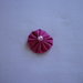 Yo-yo circolare (diametro 3 cm) di stoffa color fucsia