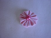 Yo-yo circolare (diametro 3 cm) di stoffa color rosa chiaro
