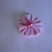 Yo-yo circolare (diametro 3 cm) di stoffa color rosa chiaro