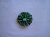 Yo-yo circolare (diametro 3 cm) di stoffa color verde