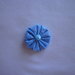Yo-yo circolare (diametro 3 cm) di stoffa color celeste