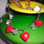 collana realizzata a mano con materiale vintage fragole e fiori argento