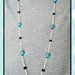 collana con catena argentata e perle in fimo azzurre
