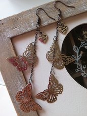 Orecchini pendenti con farfalle filigranate color argento fatti a mano
