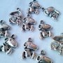 10 CHARM SNOOPY IN  ARGENTO TIBETANO , CIONDOLO, BOMBONIERA