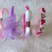 Cerchietti in plastica colorati per bambina e decorati con fiocchi, coccarde, strass e farfalle 