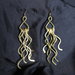 Orecchini "Medusa" realizzati in ottone battuto