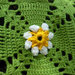 Copertina neonato a fiorellini in lana 