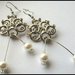 Orecchini chandelier in metallo e perle color avorio