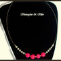 Collana rigida con perle fucsia e grigie