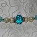 Collana con perle color panna e azzurro e mezzi cristalli