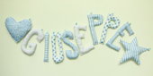 Giuseppe: nome scritto con lettere di stoffa per decorare la cameretta del tuo bambino.