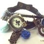 Bracciale con orologio,charm color bronzo,macaron in fimo azzurro,roselline in resina blu con brillantini idea regalo!!