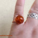 anello in rame e perla arancione in vetro