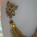 torchon di perle e cristalli sull'oro con spilla laterale