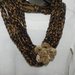 Sciarpa collana con fiore realizzata ad uncinetto marrone e color oro