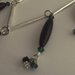 Collana di perle di corno nero e bicono Swarovski cristallo, verde smeraldo, nero e links argentati 
