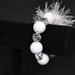 Bracciale elastico con perle bianche e fiocco di neve