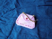 Calamita borsetta panno rosa strass rosa e catenella dorata