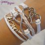 Bracciale multifile bianco scamosciato con cuori, love, infinito e treccia